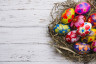 top-view-wooden-surface-with-painted-easter-eggs